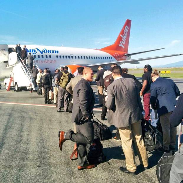 The B.C. Lions board a plane.