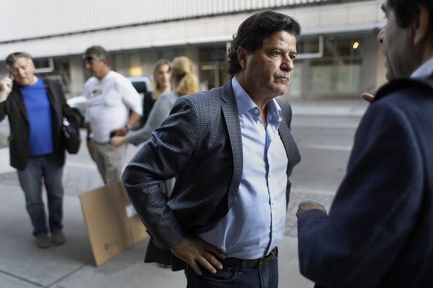 Unifor president Jerry Dias speaks with director Mohamad Alsadi in Ottawa. 