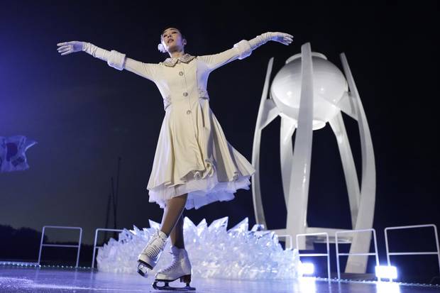 South Korean Olympic figure skating champion Yuna Kim performs before lighting the Olympic flame during the opening ceremony of the 2018 Winter Olympics in Pyeongchang, South Korea, on Friday.