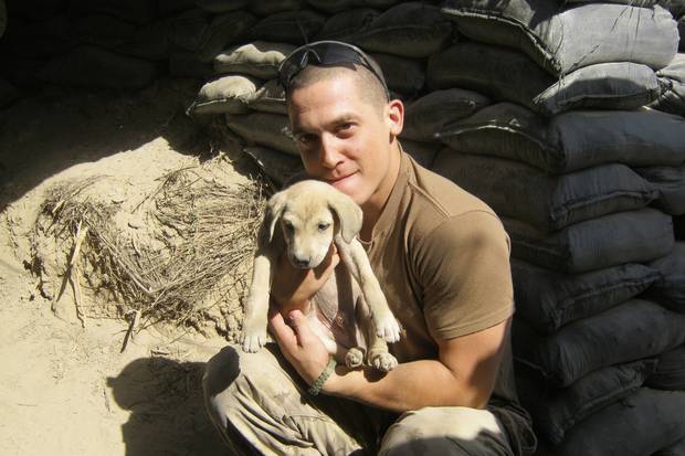 Mr. Kennedy with a local puppy in Kandahar, Afghanistan in November, 2010.
