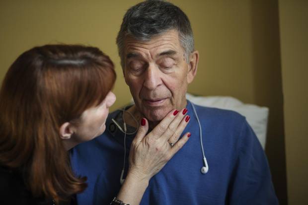 Grant Crosbie is visited by his wife, Karen Harrington, at Toronto Western Hospital.