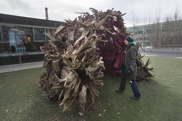 Root Cabin by Liz Wreford and Peter Sampson, Public City Architecture (Winnipeg, Canada) Like a constellation, Root Cabin is a mystery waiting to be discovered. Coloured cuts of wood can be seen through gaps in an alluring pile of weathered roots. When further explored by a visitor, the colours reveal a void that can be inhabited, and an iconic, nostalgic form of Canadian dwelling emerges.