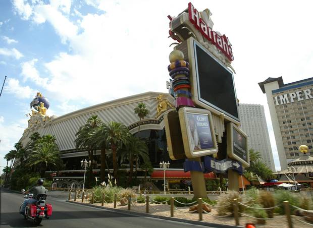 A motorcylist passes Harrah's casino in Las Vegas on June 17, 2004.