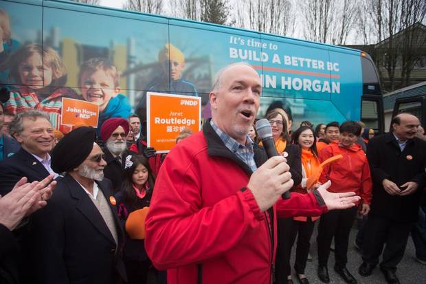 British Columbia NDP Leader John Horgan addresses supporters after unveiling his election campaign bus in Burnaby, B.C., on April 4, 2017.