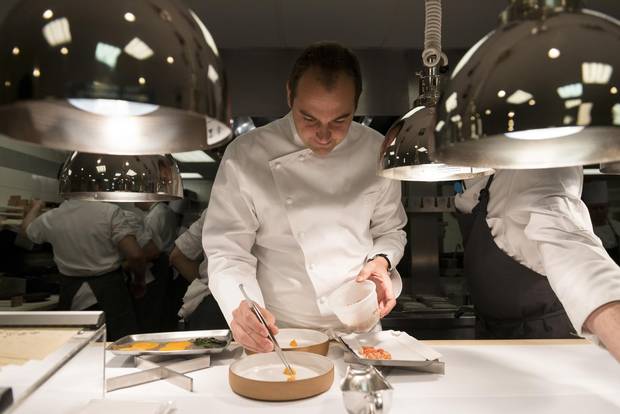 Daniel Humm, Eleven Madison Park’s chef, plates food at the restaurant in New York, Dec. 11, 2015.