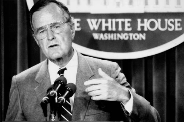 U.S. president George H.W. Bush conducts a press conference at the White House on Aug. 14, 1990.