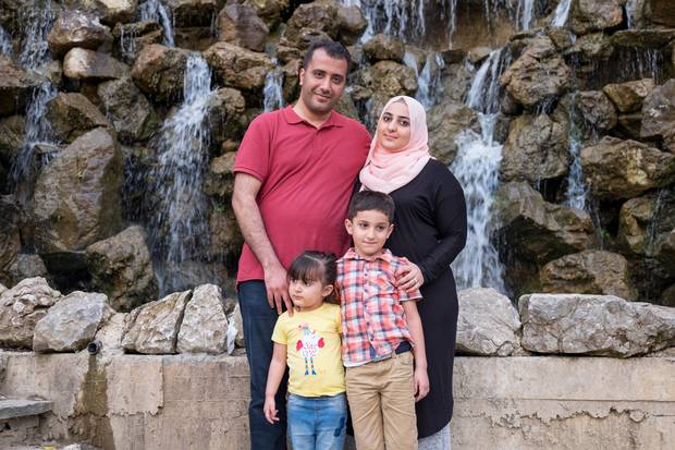 Father Waleed and mother Duaa are shown with their children Khaled, 6, and Lana, 3. The family is now living in Istanbul while waiting for their refugee applications to be processed.