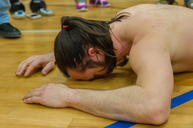 Alaska's Nick Hanson collapses on the floor after completing a 51.44 second attempt in the airplane event. Hanson's time ended up being good enough to net him a sliver medal.