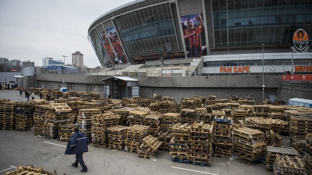 Empty pallets show what the stadium that once housed Donetsk’s professional soccer team is now used for: a distribution centre for food aid.