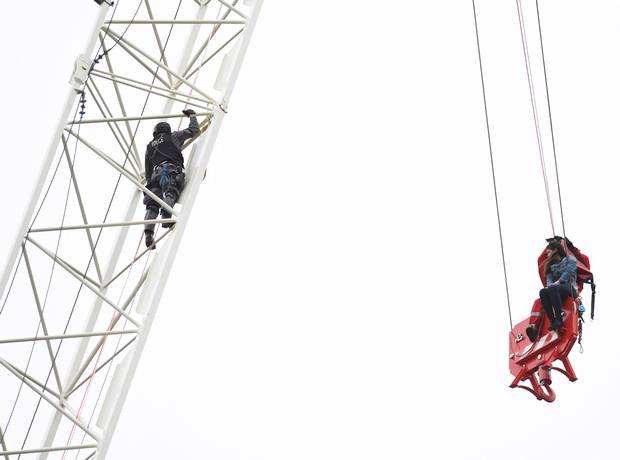 A woman is rescued from a downtown Toronto crane early on April 26, 2017.