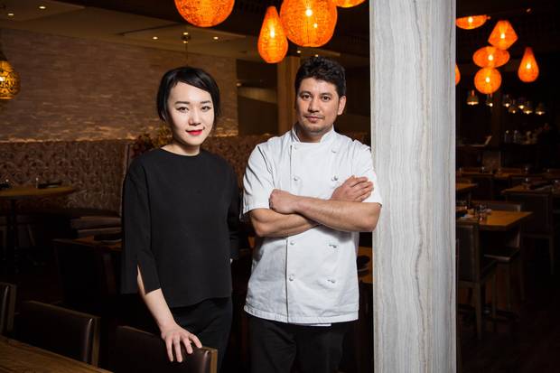 Yoona Lee, owner, is pictured with head chef Bhupinder Singh at Delhi 6 Indian bistro in Vancouver, B.C., on Jan. 30, 2018. 