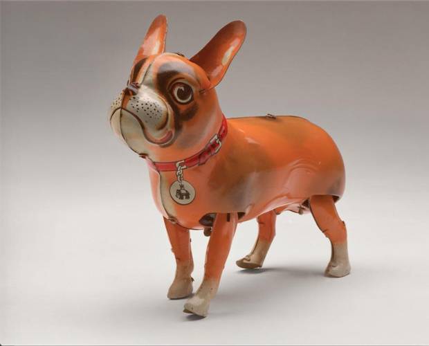 A Blomer & Schuler clockwork tin toy of a French bulldog (c. 1950) with the company’s “Jumbo” logo on its collar tag.
