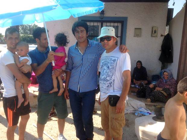 Mikahil Akbary, second from right, stands with some of his travelling companions – all from Afghanistan – in Bodrum, Turkey.