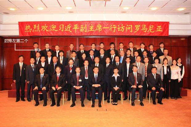 Wilson Wang (second from left in the back row, indicated with an arrow) has been detained, interrogated and tortured in China after being sentenced for bribery. This photo from 2009 – at a gathering in Romania with future Chinese president Xi Jinping, shown in the middle of the front row – contradicts key testimony in the case against him.