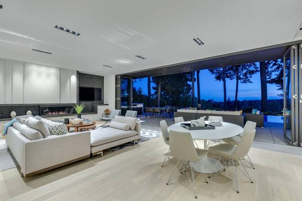 The modern family room opens to the pool area.