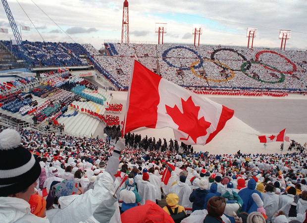 Fans cheer during the opening ceremony of the 1988 Winter Olympics in Calgary.