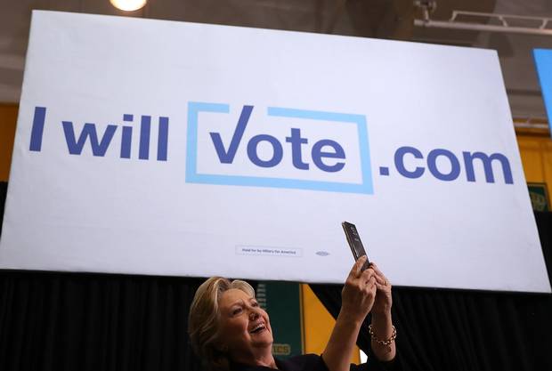 Hillary Clinton takes a selfie with supporters during a campaign rally at Wayne State University on Oct. 20 in Detroit, Michigan.