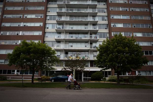 Mr. Sharbaji takes his 90-year-old mother, Fakhira, for her daily walk outside his apartment.