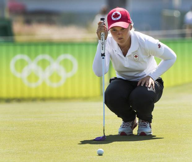 Canada's Brooke Henderson, from Smiths Falls, Ont., lines up a putt on the ninth hole during first round golf action at the 2016 Summer Olympics Wednesday, August 17, 2016 in Rio de Janeiro, Brazil.