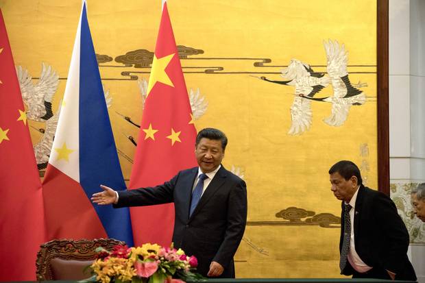 Philippine President Rodrigo Duterte, right, is shown the way by Chinese President Xi Jinping before a signing ceremony in Beijing on Oct. 20, 2016. Read Nathan VanderKlippe’s full report on Mr. Duterte’s visit to China and what he said there.