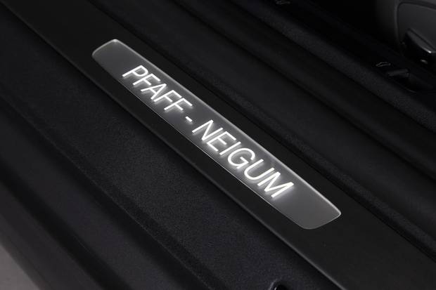 A plaque on a Sid Neigum-guided custom car from Pfaff.