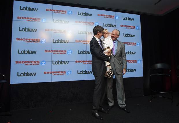 Galen G. Weston with his son and father at a 2013 press conference for the Shoppers acquisition.