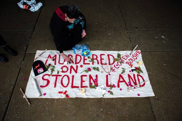 Feb. 10, 2018: Barbara Manitowabie lays flowers on a memorial for Colten Boushie as protesters gather in Nathan Phillips Square in Toronto to protest the acquittal of Gerald Stanley, who was charged with second-degree murder in connection with Mr. Boushie’s death.