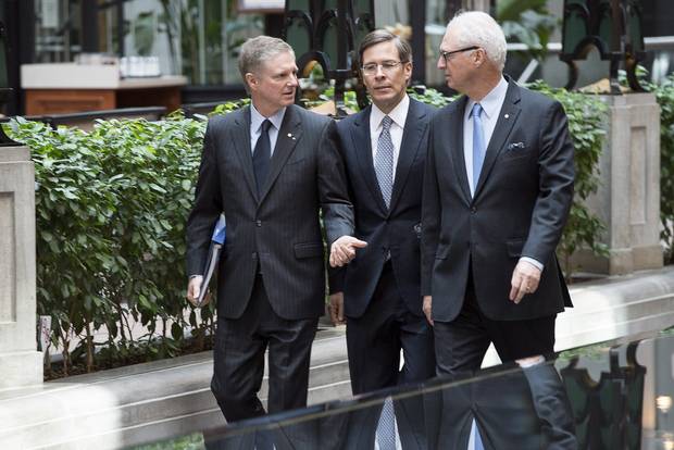 Paul Desmarais Jr., left, Jeffrey Orr, centre, and Andre Desmarais at Power Corp.'s 2014 annual meeting in Montreal.
