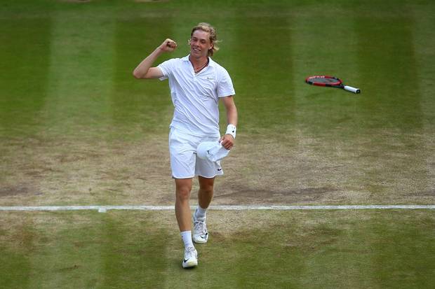 Denis Shapovalov of Canada celebrates victory during the Boy's Singles Final against Alex De Minaur of Australia on day thirteen of the Wimbledon Lawn Tennis Championships at the All England Lawn Tennis and Croquet Club on July 10, 2016 in London, England.