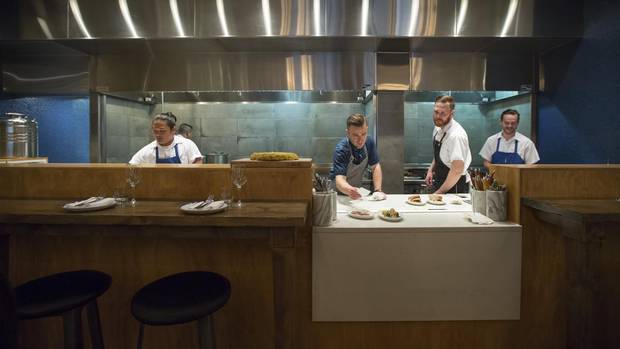 From left: Kristy Makinano, Stephen Smee, Andrew Moore, and Neil Maclean work the line at Ten Foot Henry during the lunch hour rush in Calgary.