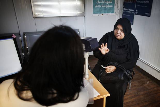 60-year-old Fatima sits in the interviewing room at the UNHCR registration office in Amman. She made the list UNHCR is recommending to Canada along with her 18-year-son who currently works in a blinds factory and hopes to continue hie education.