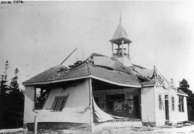 A view of the post-explosion aftermath at Tufts’ Cove School House, at the northeast corner of Albro Lake Road and the road to Tufts’ Cove, just north of Dartmouth.