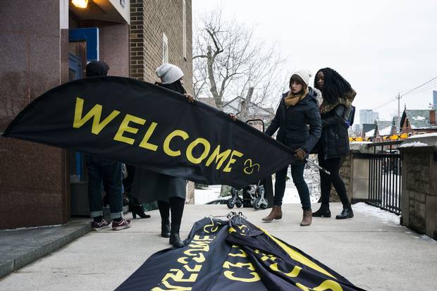 Volunteers help take down signs after C3’s service.