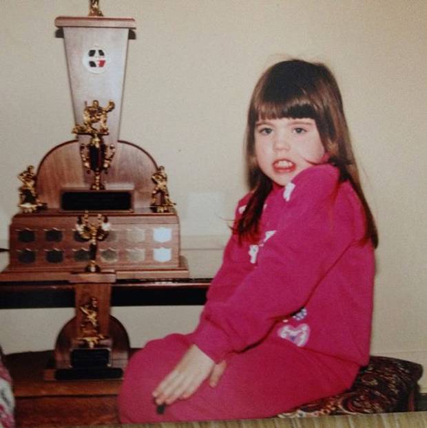 Mx. Gilmer-Osborne is shown with family trophies around 1996.