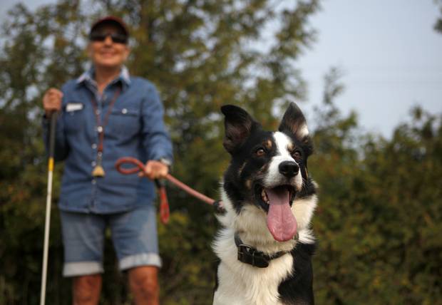 Anne Charlton with Pete, 3, waits to compete.
