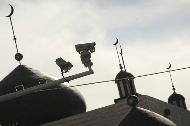 Security cameras are seen on a street in Urumqi, capital of China's Xinjiang region on July 2, 2010.