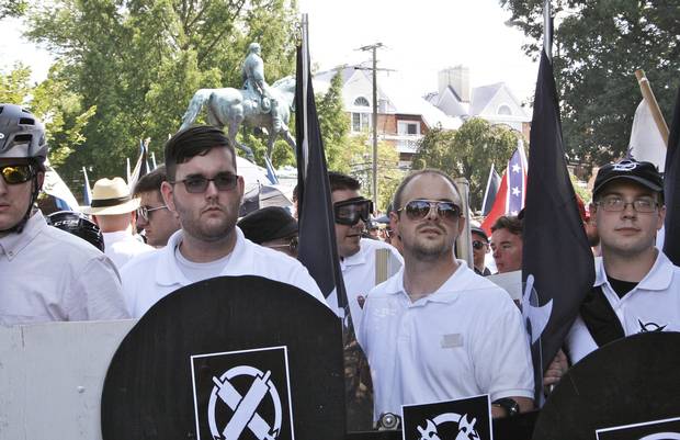 James Alex Fields Jr., second from left, holds a black shield in Charlottesville, where a white supremacist rally took place.