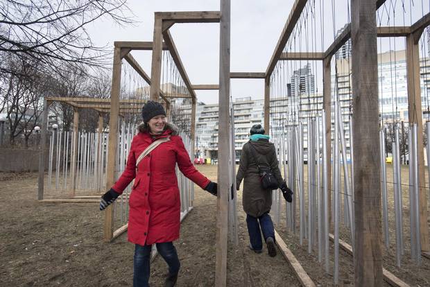 Laura Bunston (RED) and her sister Marcia, explore an art installation set up at the Music Garden on Jan 25 2018. 'Ensemble' by Joo Arajo Sousa and Joana Correia Silva, JJs Arquitectura (Porto, Portugal). Ensemble merges architecture, music and astronomy to explore the dialogue between humans and the urban environment. The installation is inspired by wind chimes, which visitors can touch to create beautiful abstract compositions and ever-changing soundscapes.