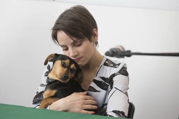 Meagan Duhamel, Olympic figure skater and gold medalist, hugs her rescue dog Moo-tae (Moo for short) that she brought back from Korea last year, at the offices of the Humane Society International/Canada in Montreal, March 15, 2018.