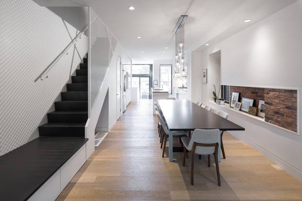 The poplar staircase features built-in shoe storage.