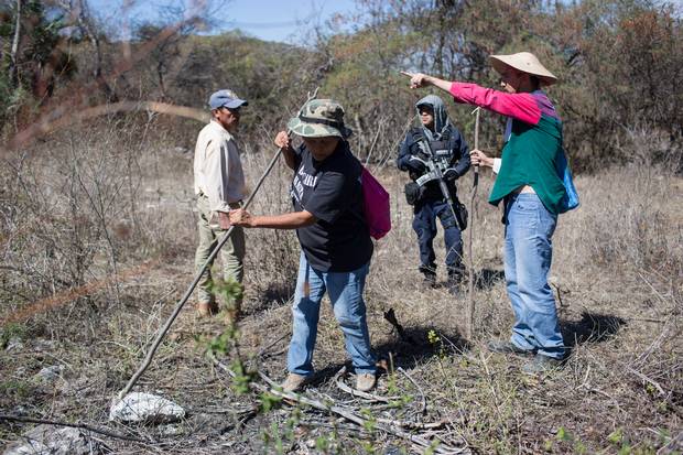 Family members search the mountains near Huitzuco.