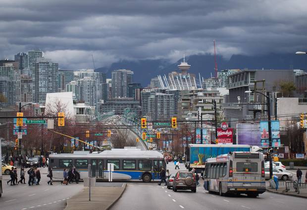 A TransLink bus travels on West Broadway in Vancouver, B.C., on Wednesday March 22, 2017.