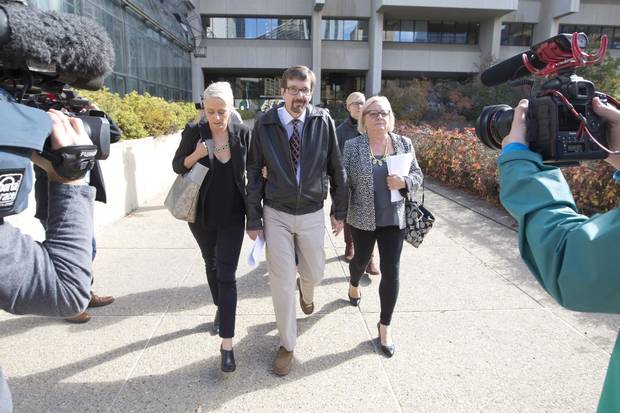 Nicole Walshe, daughter of Bret McCann; Bret McCann; and his wife Mary-Ann McCann leave the courthouse after Travis Vader was convicted of two counts of second-degree murder in the deaths of Lyle and Marie McCann.