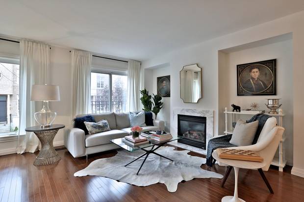 Ms. Souligny couldn't remove the bulkhead in the living room, so she used it to create symmetrical shelving nooks.