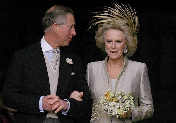 Prince Charles and The Duchess of Cornwall leave St. George's Chapel in Windsor Castle, southern England, following the Service of Prayer and Dedication following their marriage, April 9, 2005.