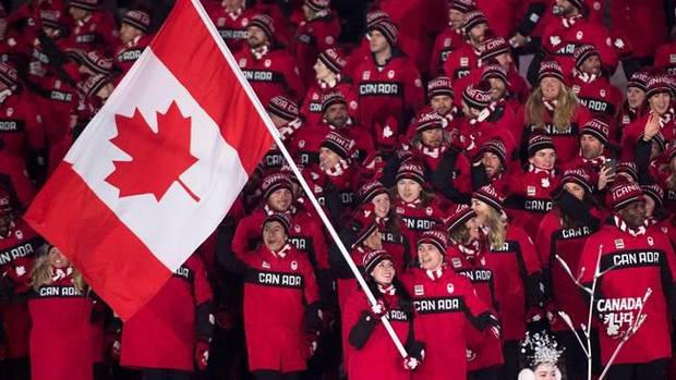 Canadian ice dance team Tessa Virtue and Scott Moir lead team Canada into the Olympic stadium as the flag bearers during the opening ceremonies at the 2018 Winter Olympic Games in Pyeongchang, South Korea, on Friday, February 9, 2018. THE CANADIAN PRESS/Nathan Denette