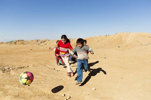 Children play soccer at Zaatari refugee camp in Jordan on Dec. 12, 2015.