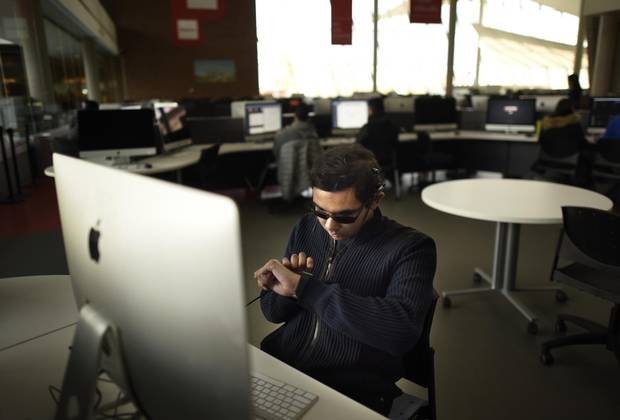 Visually and hearing-impaired student Zeeshan Mahmood had electronic devices that enable him to hear surgically inserted when he was 16.