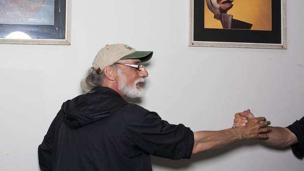 Member Paul Michaud greets a fellow Dude: The program helps the men recapture their inner ‘warrior.’