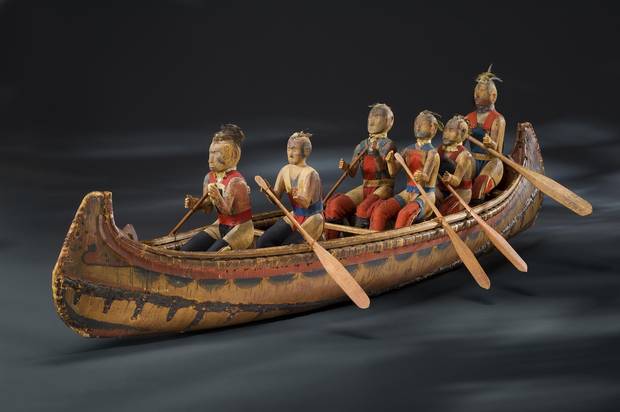 A model canoe with figures representing individual Indigenous warriors and leaders, made by the Odawa chief, Assiginak, in about 1825.